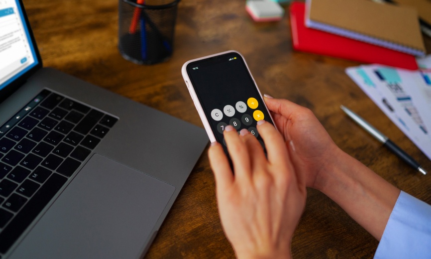 Person using calculator app on their phone