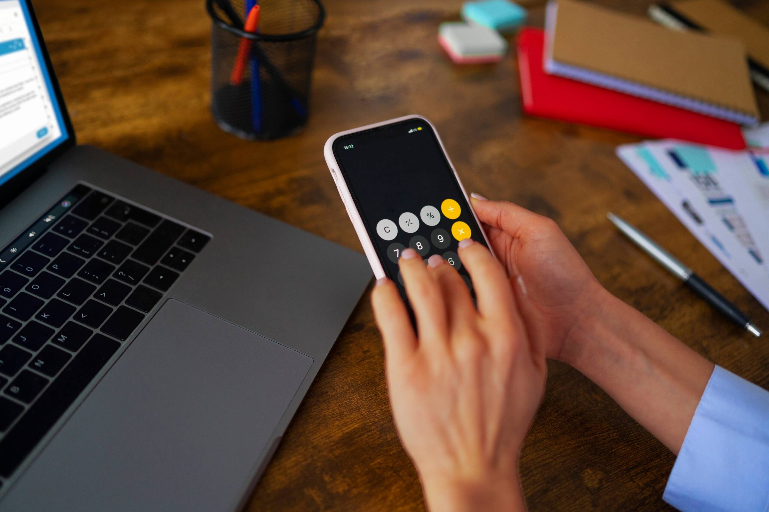 Person using calculator app on their phone