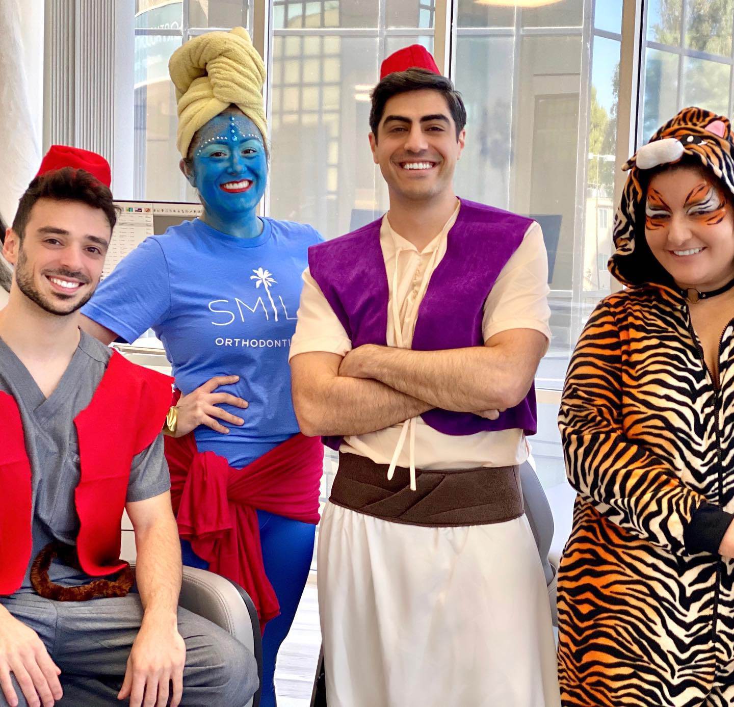 Team members dressed up as Aladdin characters